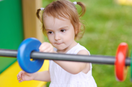 Little girl with giant toy abacusの写真素材