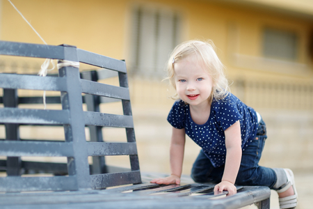 Adorable toddler girl portrait outdoors at summerの写真素材