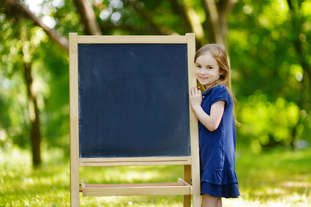 Adorable little schoolgirl feeling very excited about going back to schoolの写真素材