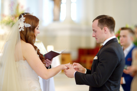 Bride and groom at the church during a wedding ceremonyの写真素材