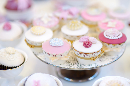 Delicious colorful cupcakes for wedding reception or other event partyの写真素材
