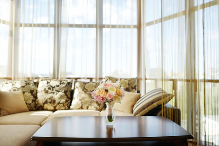 Beautiful vintage wedding bouquet on a table in luxury hotel roomの写真素材