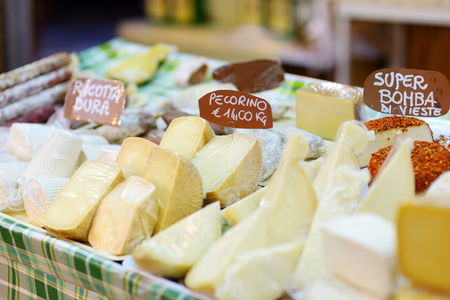 Large selection of cheeses on typical italian farmer marketの写真素材