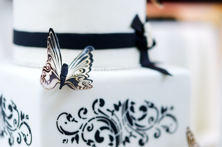 Beautiful white and black butterfly wedding cakeの写真素材