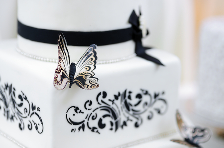 Beautiful white and black butterfly wedding cakeの写真素材