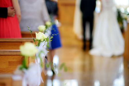 Beautiful flower wedding decoration in a church during catholic wedding ceremonyの写真素材