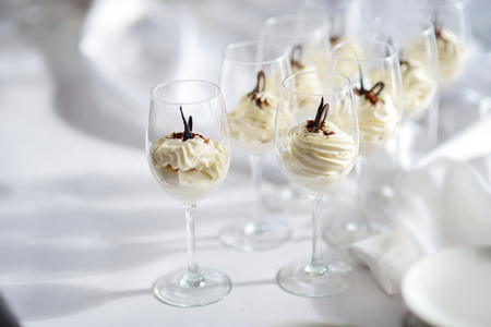 Traditional italian cream cheese dessert served in wine glassesの写真素材
