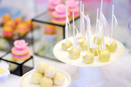 Beautiful desserts, sweets and candy table at wedding reception or other eventの写真素材