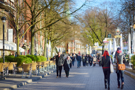 BREMEN, GERMANY - MARCH 23, 2016: Embarktment of Weser river in Bremen is very popular among tourists. Many shops and restaurants can be found there.のeditorial素材