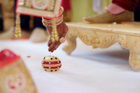 Amazing hindu wedding ceremony. Details of traditional indian wedding. Beautifully decorated hindu wedding accessories. Indian marriage traditions.