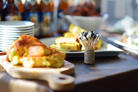 Different kinds of wine snacks and variuos cheeses on white tableの写真素材