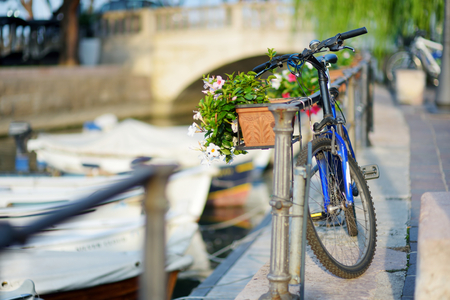 Some bikes parked in small italian townの写真素材