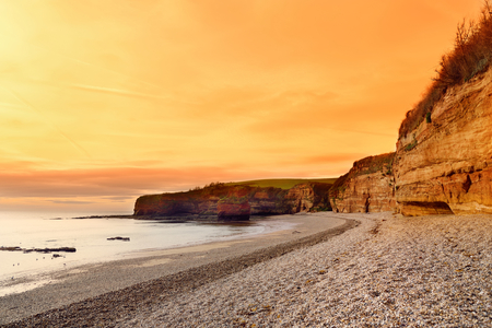 Impressive red sandstones of the Ladram bay on the Jurassic coast, a World Heritage Site on the English Channel coast of southern England, Devon, UK.の写真素材