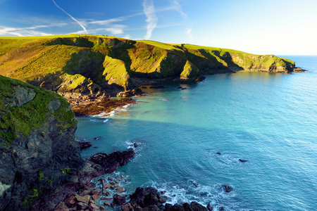 Scenic rugged Cornish coastline near Port Isaac historic fishing village on sunny morning, Cornwall, Englandの写真素材
