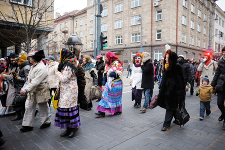VILNIUS, LITHUANIA - FEBRUARY 25, 2017: Hundreds of people celebrating Uzgavenes, a Lithuanian annual folk festival taking place before Easter. Participants wearing traditional masks and costumes.のeditorial素材