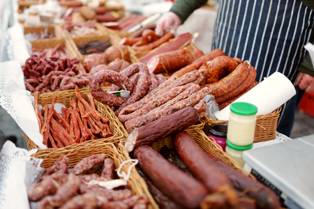 Selection of assorted home made sausages on a farmer's market in Vilnius, Lithuania. Traditional spring fair in capital of Lithuania.の写真素材