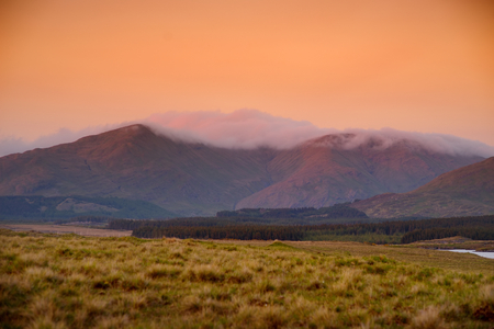 Beautiful sunset view of Connemara region in Ireland. Scenic Irish countryside landscape with magnificent mountains on the horizon, County Galway, Ireland.の写真素材