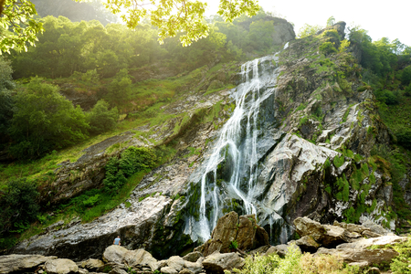 Majestic water cascade of Powerscourt Waterfall, the highest waterfall in Ireland. Famous tourist atractions in co. Wicklow, Ireland.の写真素材