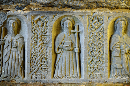 Monks and ornaments carved in stone in a ruined Jerpoint Abbey, located near Thomastown, County Kilkenny, Ireland.の写真素材