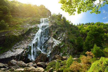 Majestic water cascade of Powerscourt Waterfall, the highest waterfall in Ireland. Famous tourist atractions in co. Wicklow, Ireland.の写真素材