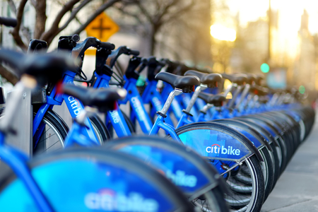 NEW YORK - MARCH 15, 2015: Row of Citi bike rental bicycles at docking station in New York City. Shared bikes lined up in the street of New York, USA.のeditorial素材