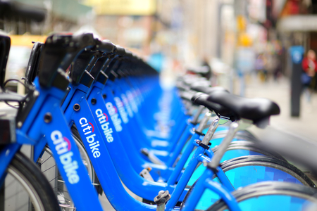 NEW YORK - MARCH 15, 2015: Row of Citi bike rental bicycles at docking station in New York City. Shared bikes lined up in the street of New York, USA.のeditorial素材