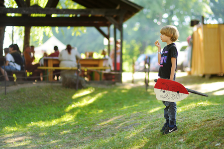 TRAKAI, LITHUANIA - JUNE 16, 2018: Children having fun during annual Medieval Festival, held in Trakai Peninsular Castle. Recreating medieval town spirit.のeditorial素材