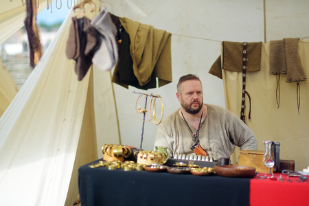 KERNAVE, LITHUANIA - JULY 6, 2018: Historical reenactment activists wearing medieval costumes during...