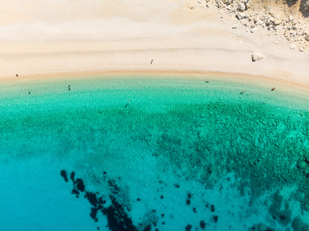 Aerial top down view of Myrtos beach, the most famous and beautiful beach of Kefalonia, a large...