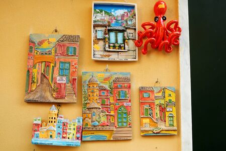 MANAROLA, ITALY - NOVEMBER 18, 2018: Various food, goods and small typical souvenirs sold at small shops at the pedestrian area of Manarola village, Cinque Terre, Liguria.のeditorial素材