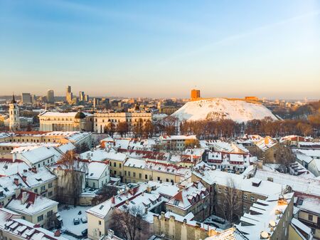 Beautiful Vilnius city panorama in winter with snow covered houses, chruches and streets. Aerial evening view. Winter city scenery in Vilnius, Lithuania.の写真素材