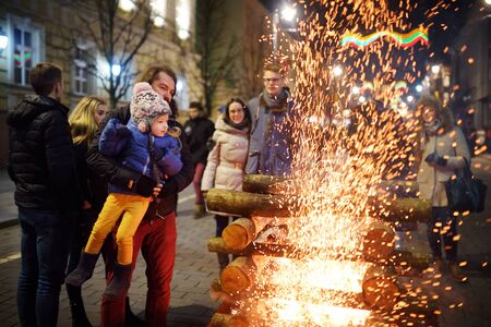 VILNIUS, LITHUANIA - FEBRUARY 16, 2018: Hundreds of people attending the celebration of Restoration of the State Day in Vilnius. Bonfires are lit on Gediminas avenue on festive night on February 16.のeditorial素材