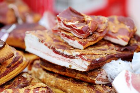 Selection of assorted home made meats, jerky and sausages on a farmer's market in Vilnius, Lithuania. Traditional spring fair in capital of Lithuania.の写真素材