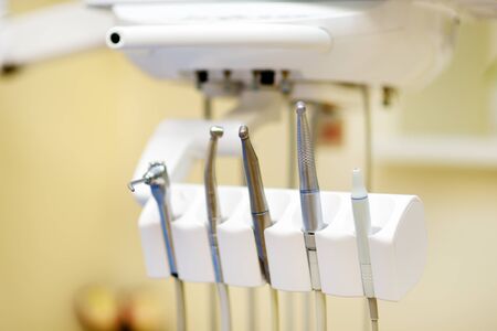 Different dental instruments and tools in a dentists office. Closeup of a modern dentist tools and...