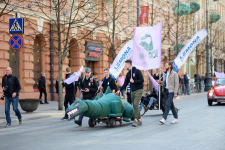 VILNIUS, LITHUANIA - APRIL 6, 2019: People participating in Physicists Day (FiDi), a humorous event with traditional Dinosaur Parade organized annually by The Faculty of Physics of Vilnius Universityのeditorial素材
