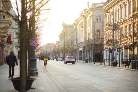 VILNIUS, LITHUANIA - APRIL 10, 2020: Townspeople and tourists strolling on the Gedimino Avenue, one of the oldest and most flamboyant street in the Old Town of Vilnius.のeditorial素材
