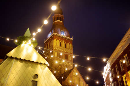 The most authentic Christmas market in Riga offering dozens of crafts and food stalls, as well as giant Christmas tree. Night time.の写真素材