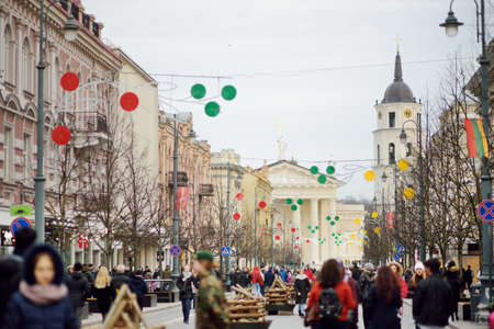 VILNIUS, LITHUANIA - FEBRUARY 16, 2020: Hundreds of people attending the celebration of Restoration of the State Day in Vilnius. Bonfires are lit on Gediminas avenue on festive night on February 16.のeditorial素材
