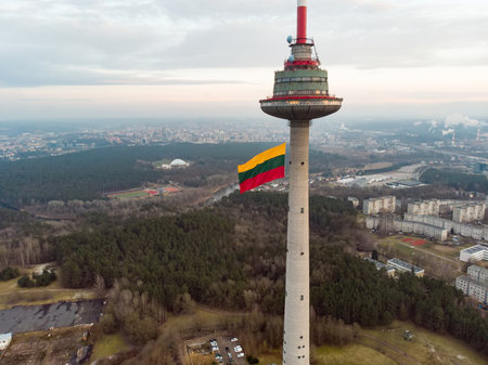 VILNIUS, LITHUANIA - FEBRUARY 16, 2020: Giant tricolor Lithuanian flag waving on Vilnius television tower on the celebration of Restoration of the State Day in Vilnius.のeditorial素材