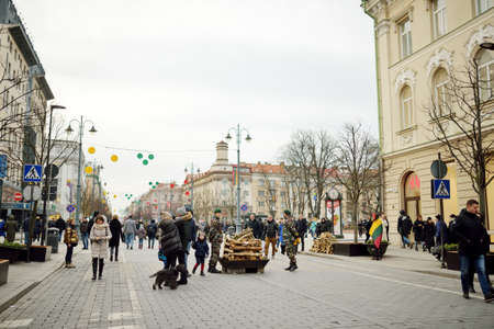 VILNIUS, LITHUANIA - FEBRUARY 16, 2020: Hundreds of people attending the celebration of Restoration of the State Day in Vilnius. Bonfires are lit on Gediminas avenue on festive night on February 16.のeditorial素材