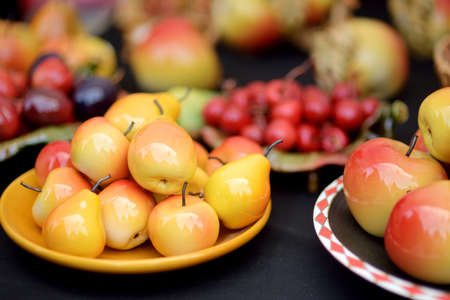 Colorful ceramic fruits and other decorations sold on Easter market in Vilnius. Lithuanian capital's annual traditional crafts fair is held every March on Old Town streets.の写真素材