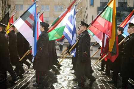 VILNIUS, LITHUANIA - MARCH 11, 2020: Festive parade as Lithuania marked the 30th anniversary of its independence restoration. Parade participants carrying national flags.のeditorial素材