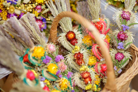 Traditional Lithuanian Easter palms known as verbos sold on Kaziukas, Easter market in Vilnius. Lithuanian capital's annual traditional crafts fair is held every March on Old Town streets.の写真素材