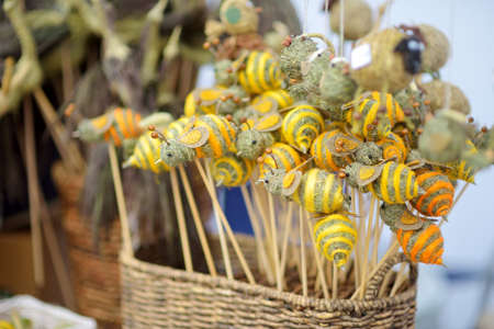 Traditional Lithuanian Easter palms known as verbos sold on Kaziukas, Easter market in Vilnius. Lithuanian capital's annual traditional crafts fair is held every March on Old Town streets.の写真素材