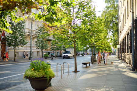 VILNIUS, LITHUANIA - JULY 10, 2020: Townspeople and tourists strolling on the Gedimino Avenue, one of the oldest and most flamboyant streets in the Old Town of Vilnius.のeditorial素材