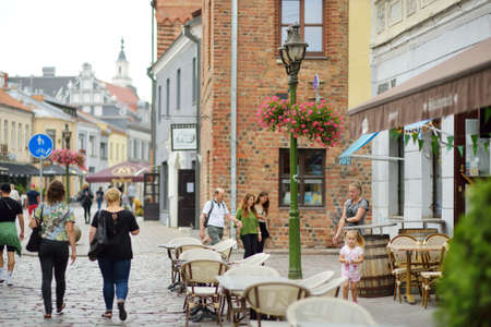 KAUNAS, LITHUANIA - AUGUST 16, 2020: Townspeople and tourists strolling on the Vilnius street (Vilniaus gatve) in medieval Kaunas old town.のeditorial素材