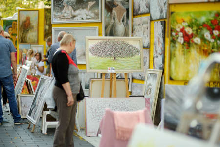 VILNIUS, LITHUANIA - SEPTEMBER 5, 2020: Artists selling their paintings at Nations Fair, where masters from the national communities of Lithuania present their arts, crafts, customs and traditions.のeditorial素材
