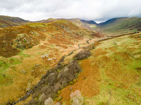 Aerial sunset view of the Lake District, famous for its glacial ribbon lakes and rugged mountains....
