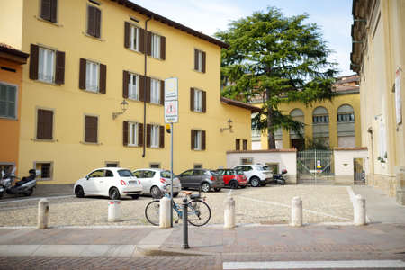 BERGAMO, ITALY - APRIL 2019: Everyday life of tourists and townspeople on beautiful medieval streets...