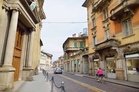 BERGAMO, ITALY - APRIL 2019: Everyday life of tourists and townspeople on beautiful medieval streets...